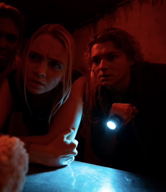 Team members solving eerie puzzles under pressure in the Zodiac Killer escape room.