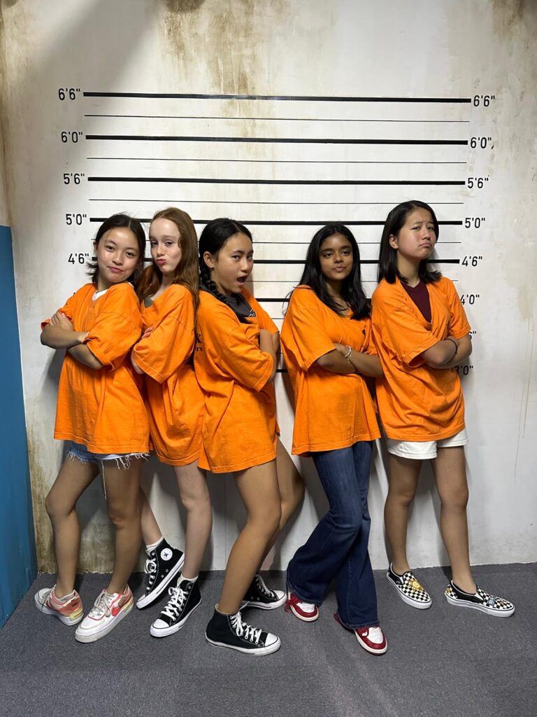 Girls celebrating and having fun during a kid-friendly escape room birthday party at Fox in a Box.