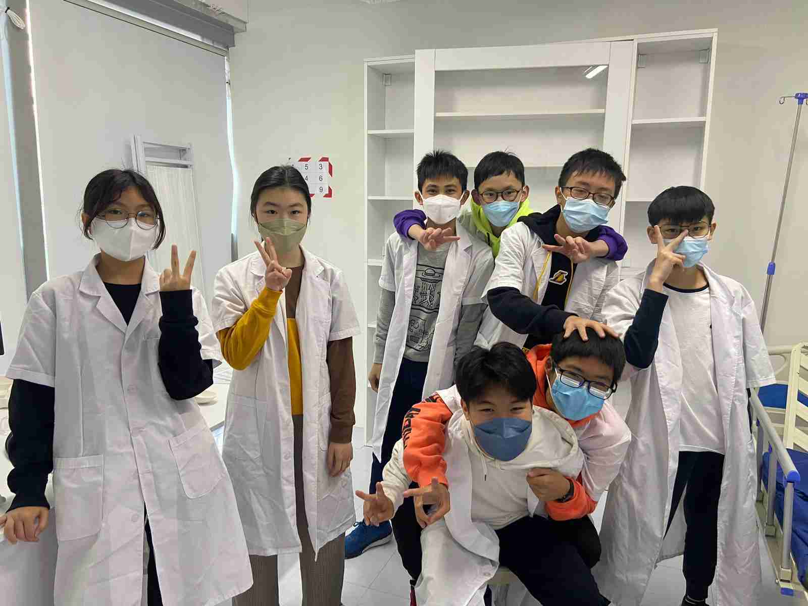 Group of classmates celebrating successful escape in Hong Kong