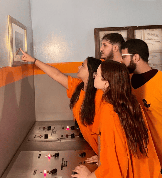 Escape Room Miami team solving puzzle together at Fox in a Box.