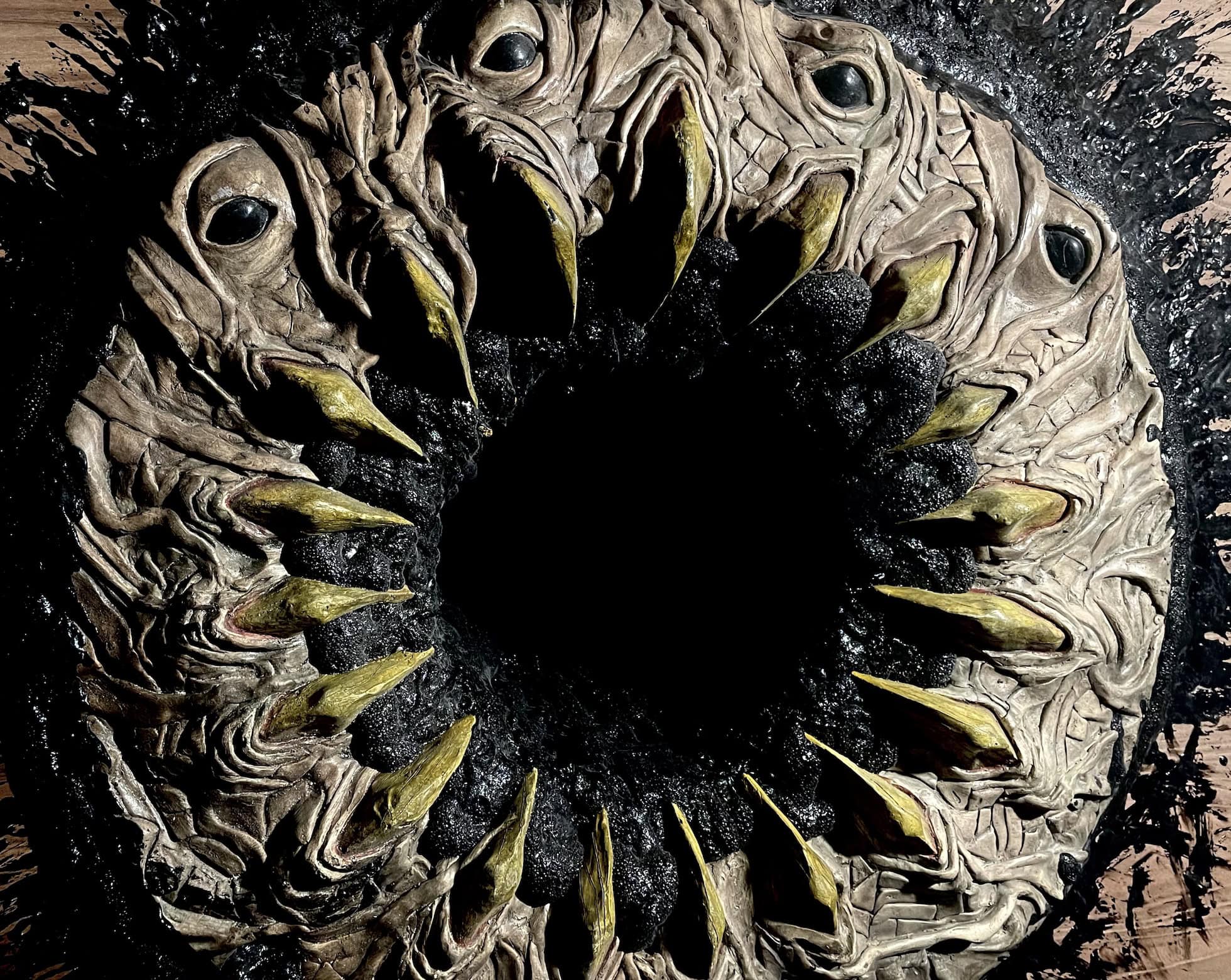 A mysterious circular arrangement of bird skulls and beaks, dark and eerie atmosphere.