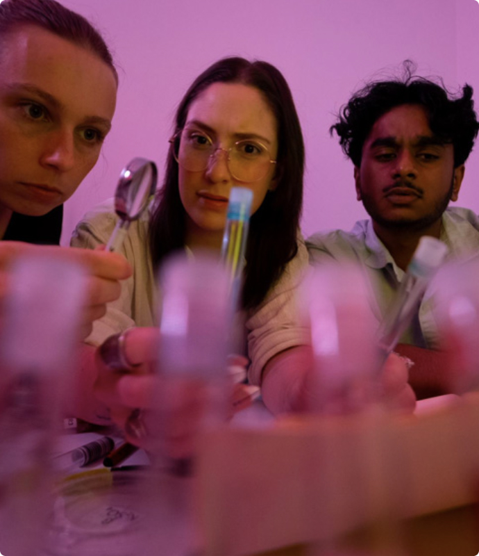 Scientists conducting experiments in a lab for room escape game at Fox in a Box Stockholm.