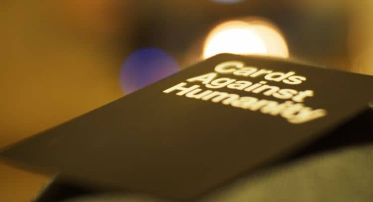 Cards Against Humanity game box on a table.