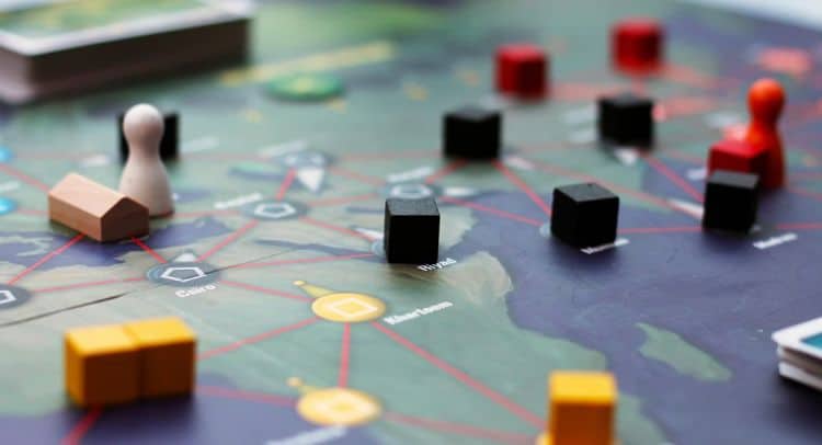 Strategic board game setup for escape room adventure at Fox in a Box Stockholm.